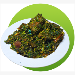 Fresh Afang soup made with okazi leaves, waterleaf and assorted meats served in a bowl.