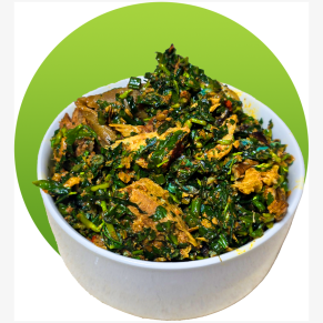 Edikaikong vegetable soup with leafy greens and assorted meats in a traditional Nigerian style.