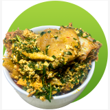 Thick Nigerian Egusi soup made with melon seeds, vegetables and seasoned meat.